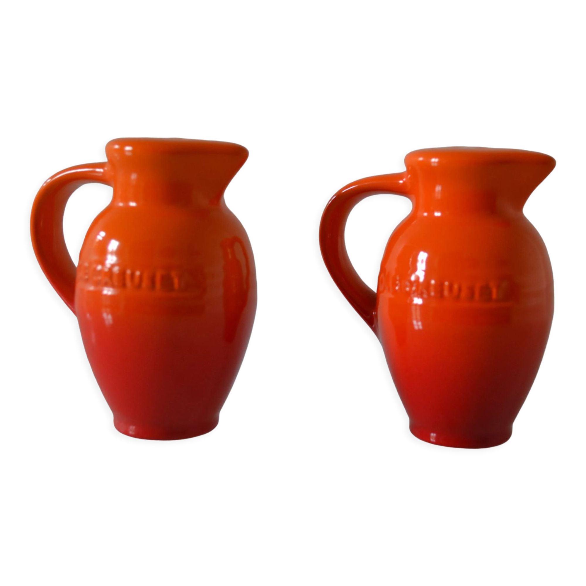 Le Creuset orange advertising salt and pepper