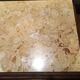 Solid oak bedside table with beige marble.
