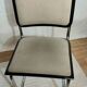 Cesca B32 chair by Marcel Breuer, upholstered in beige fabric.