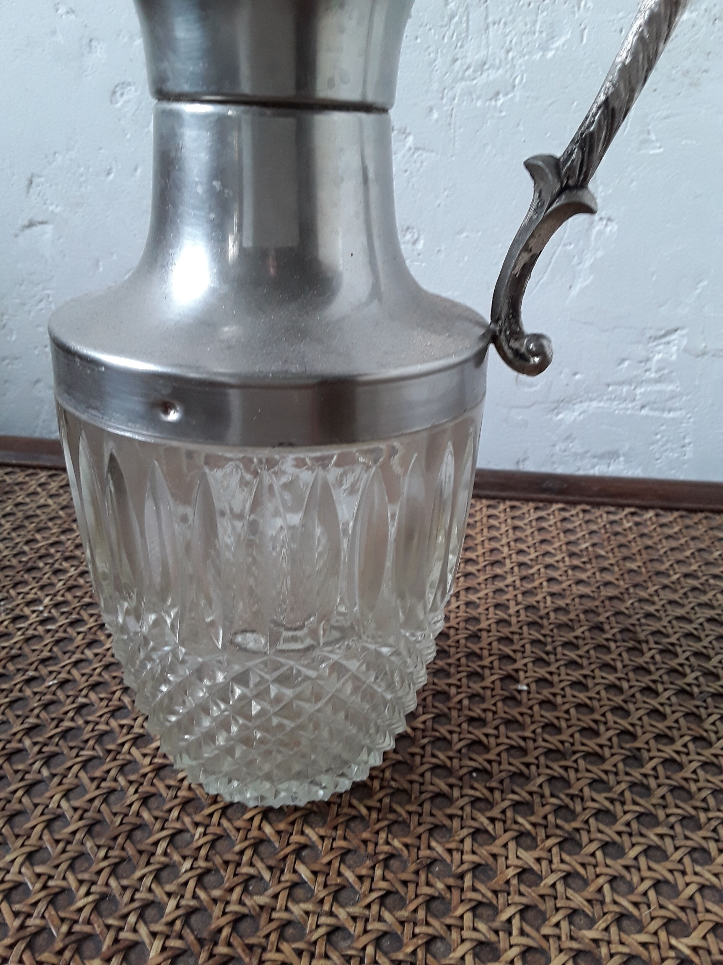 Old glass and silver metal wine carafe