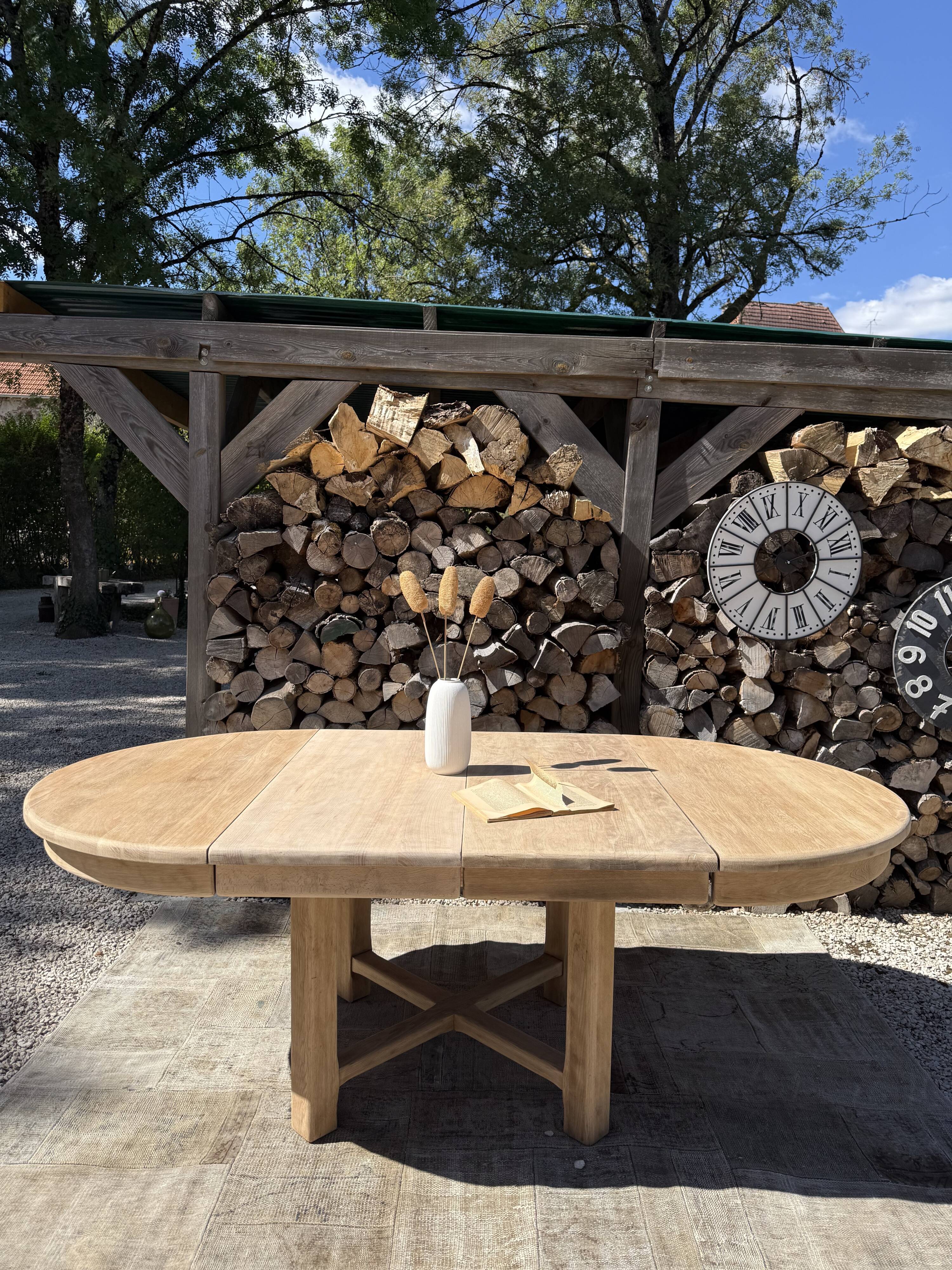 Round solid oak table with extensions, maximum 220cm.