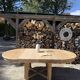 Round solid oak table with extensions, maximum 220cm.