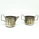 Set of sugar bowl and milk jug, neoclassicism with art deco influences, silver-plated brass, Belgium, 1930s.