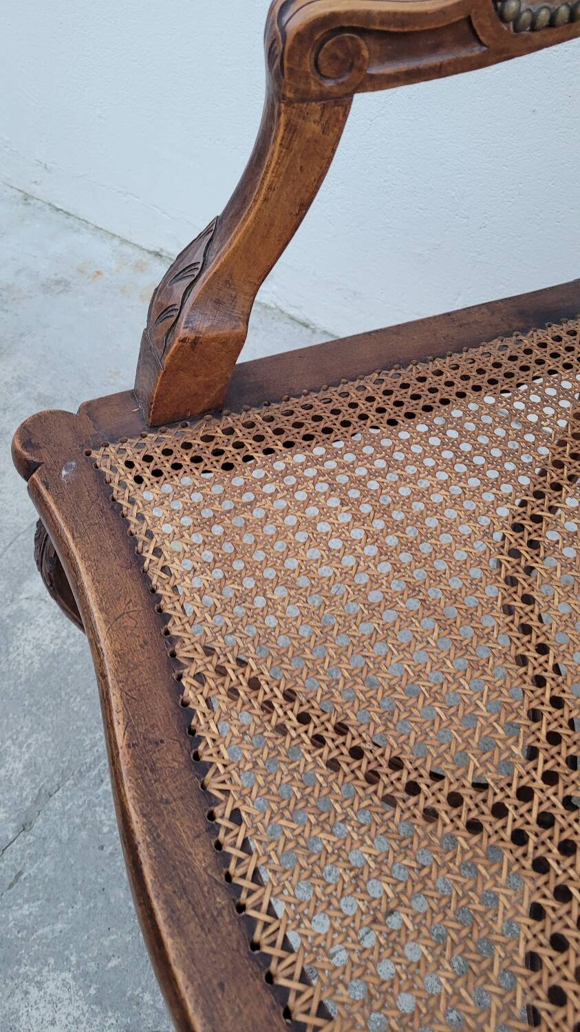 Louis XV Regency cane armchair leather armrests decorated with shell