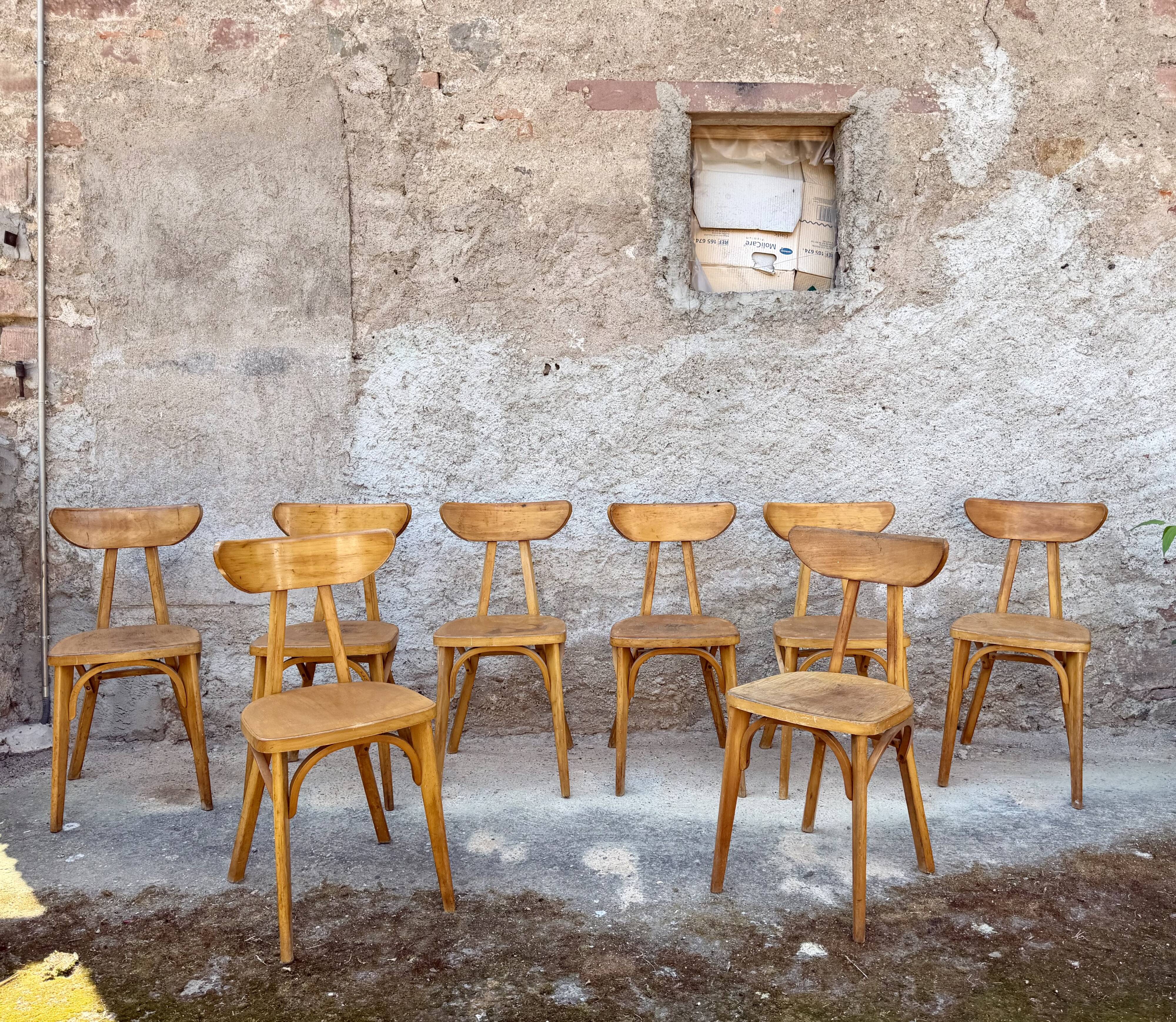 Set of 9 lutherma banana boomerang bistro chairs.