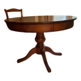 Round table with central leg in solid cherry wood