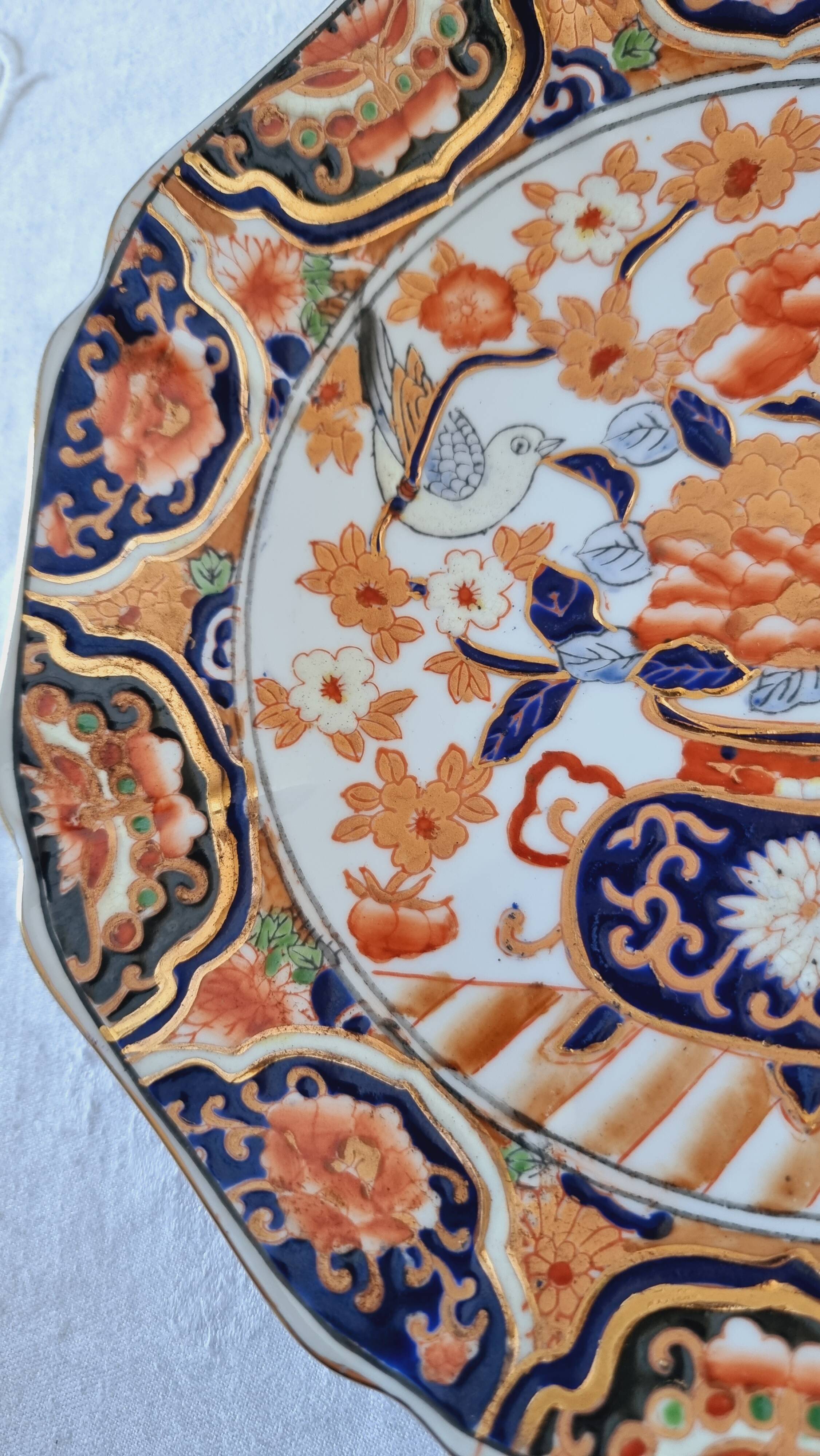 Imari-style porcelain plate, hand-painted, Japan, mid-20th century.