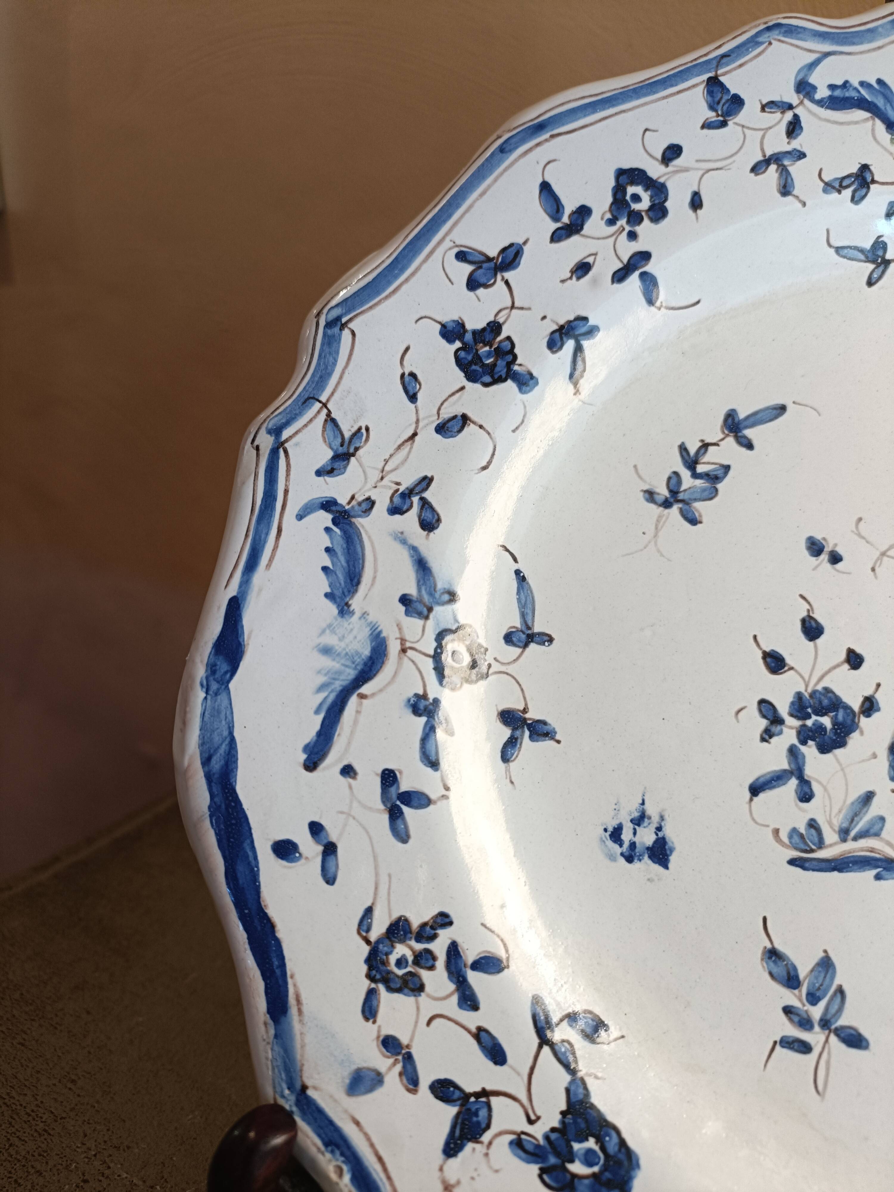 Old Moustiers faience plate blue and white with blue ibis decoration.