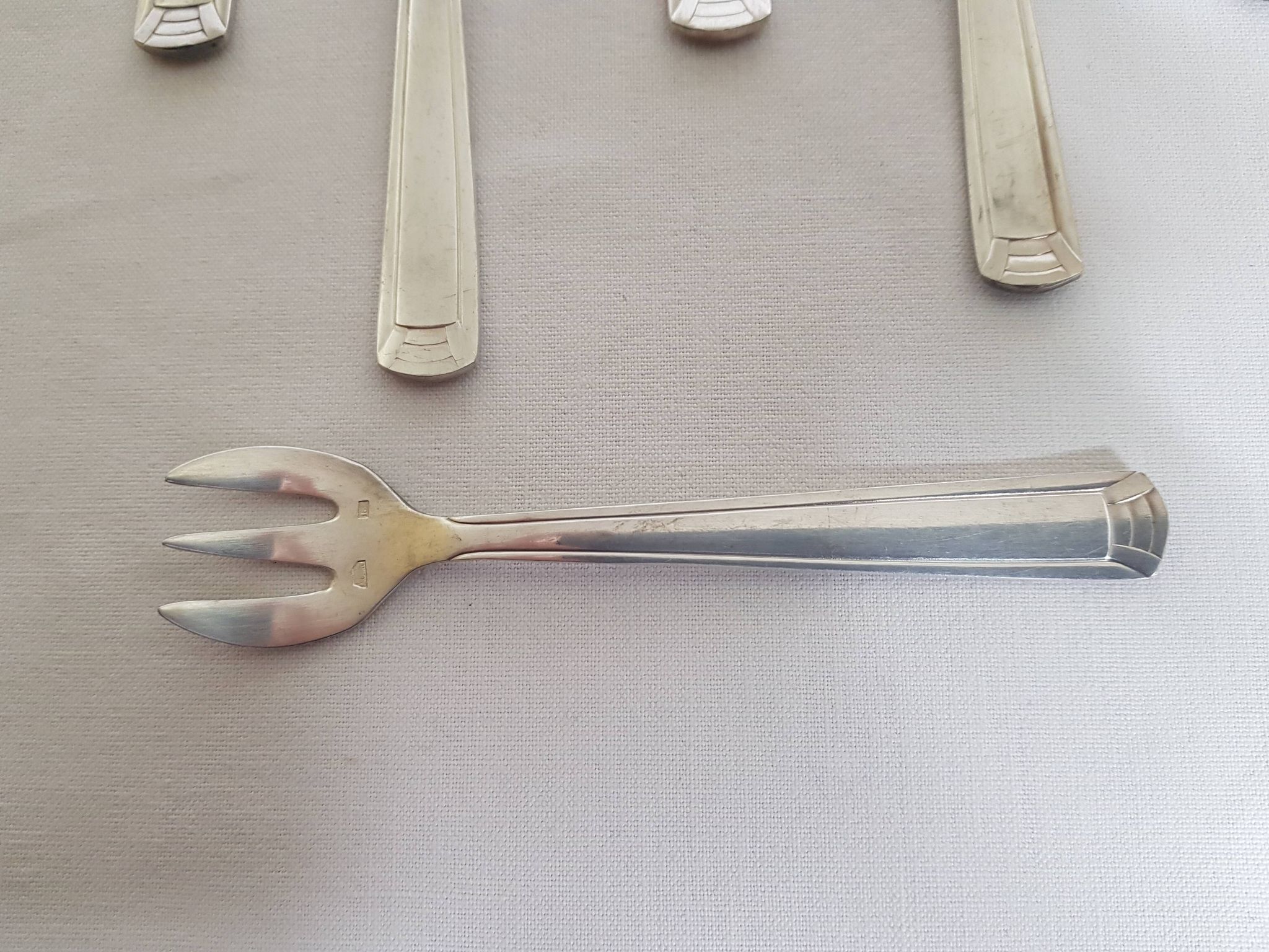 Six art deco silver metal oyster forks