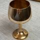 Green stemmed, brass chalices