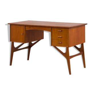 Danish mid century teak desk on sculptural base, 1960s.