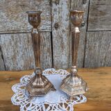 Pair of chiseled metal candle holders