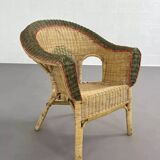 Rattan and wicker cabriolet-style armchair with green and red edging