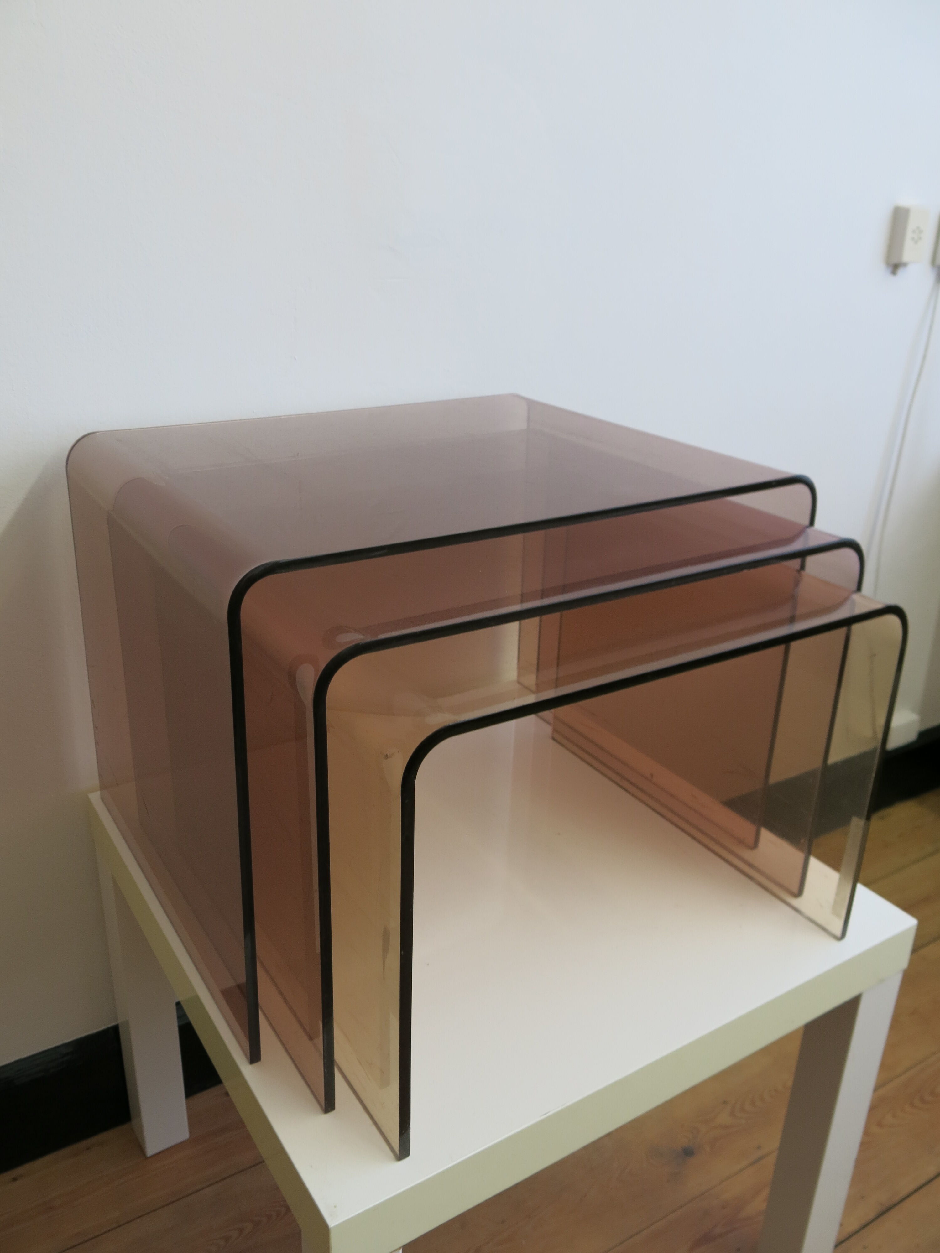 Plexi nesting tables by Michel Dumas