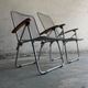 Set of two vintage folding chairs with an aluminium wire frame.