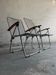 Set of two vintage folding chairs with an aluminium wire frame.