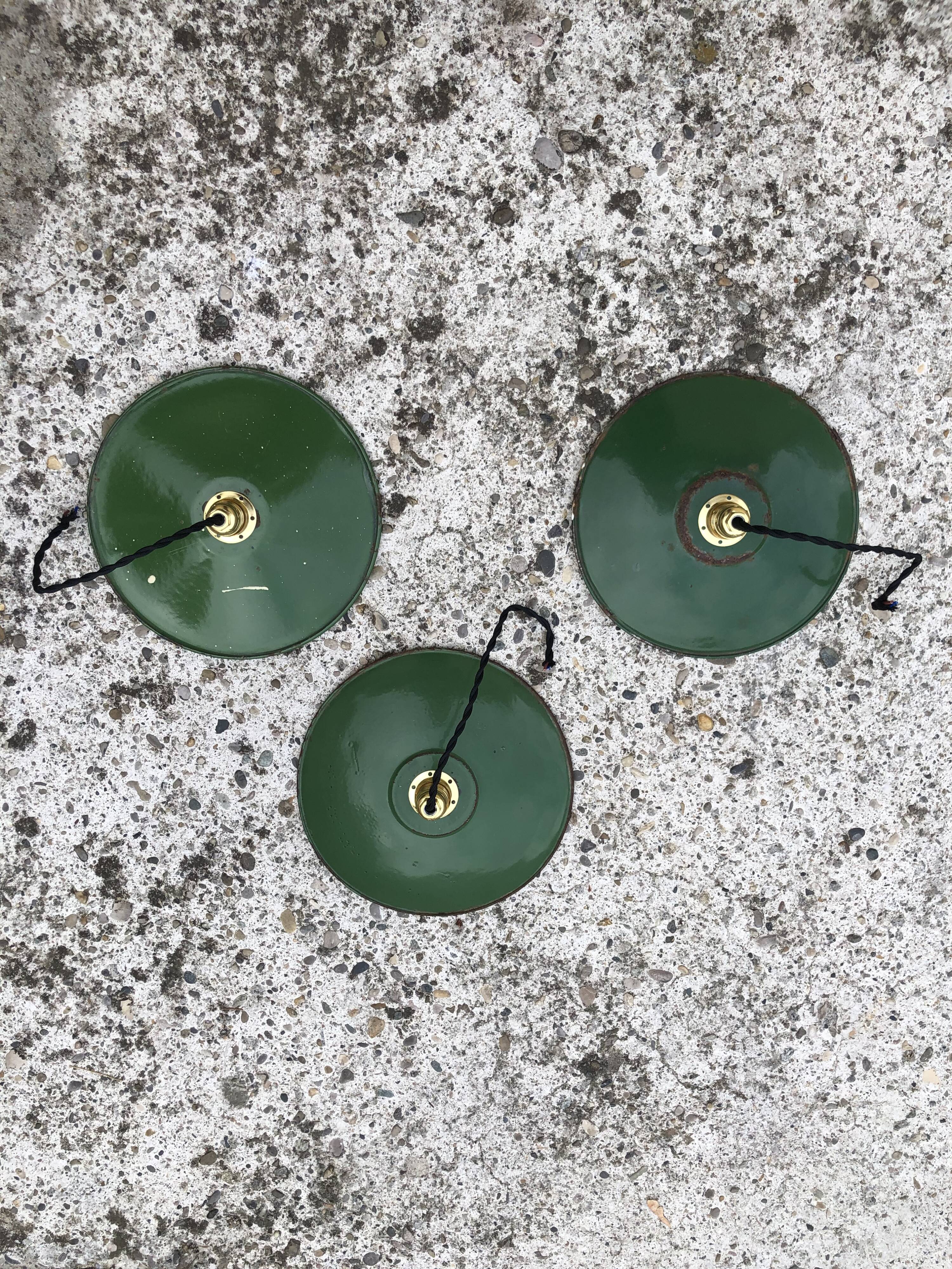 Trio in white green enamelled sheet hanging lamps