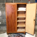 Vintage wooden cabinet with compass feet
