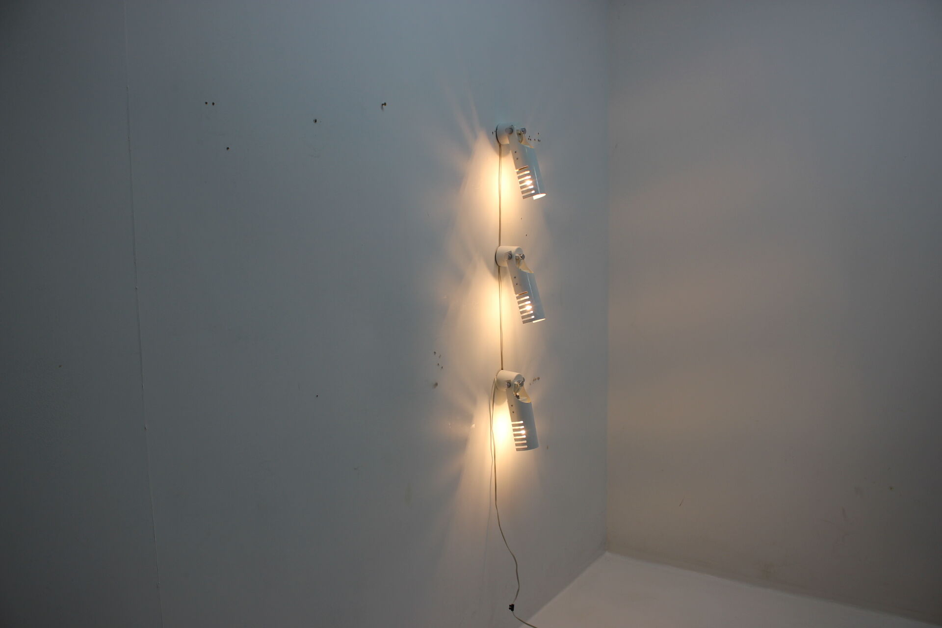 Set of three white adjustable design wall lamp, 1980's.