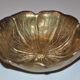 Empty-pocket flower in solid brass