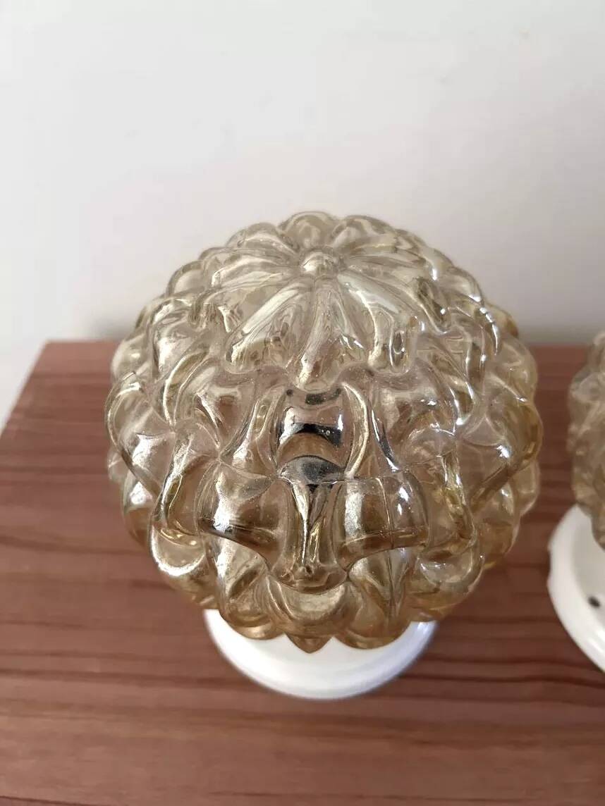 Pair of golden Scandinavian globe wall lights