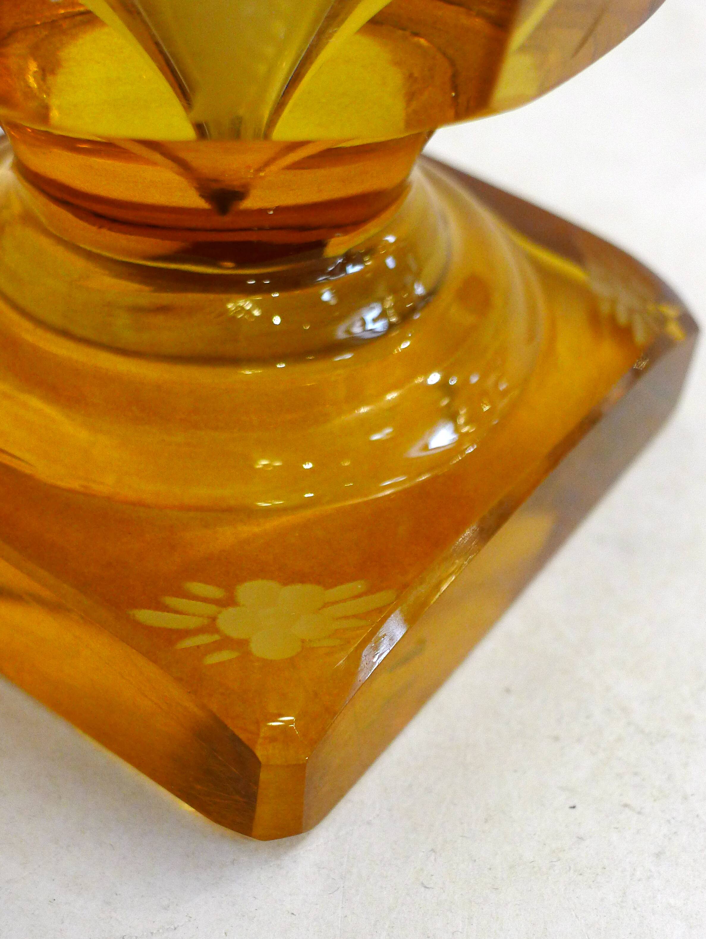 Art Deco vase engraved with flowers, faceted body on a pedestal.