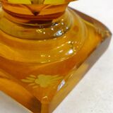 Art Deco vase engraved with flowers, faceted body on a pedestal.