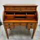 Cylinder desk with marquetry featuring a crosshatch design.