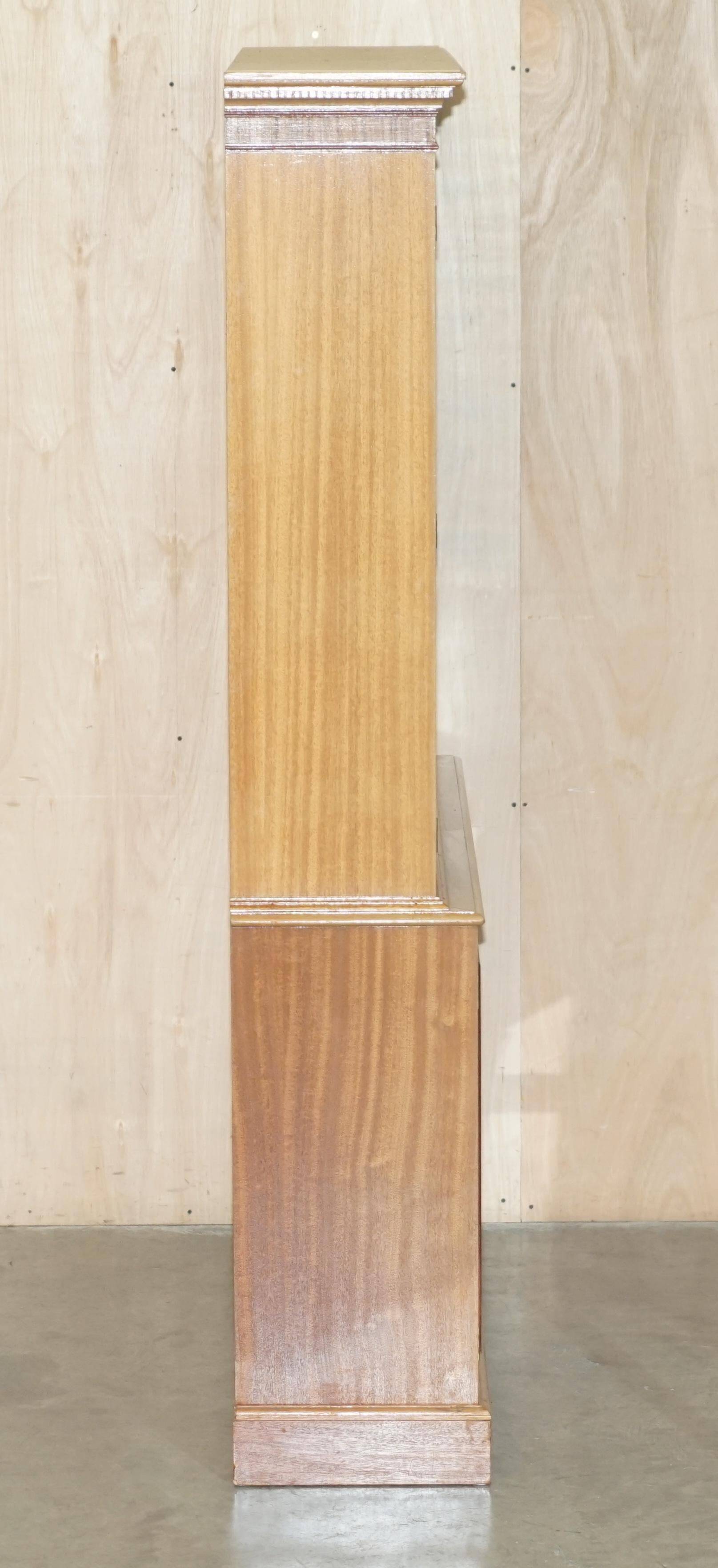 Library in the style of David Linley in satinwood, walnut, and rosewood.