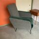 Retro armchair from around 1960 in forest green with houndstooth pattern.