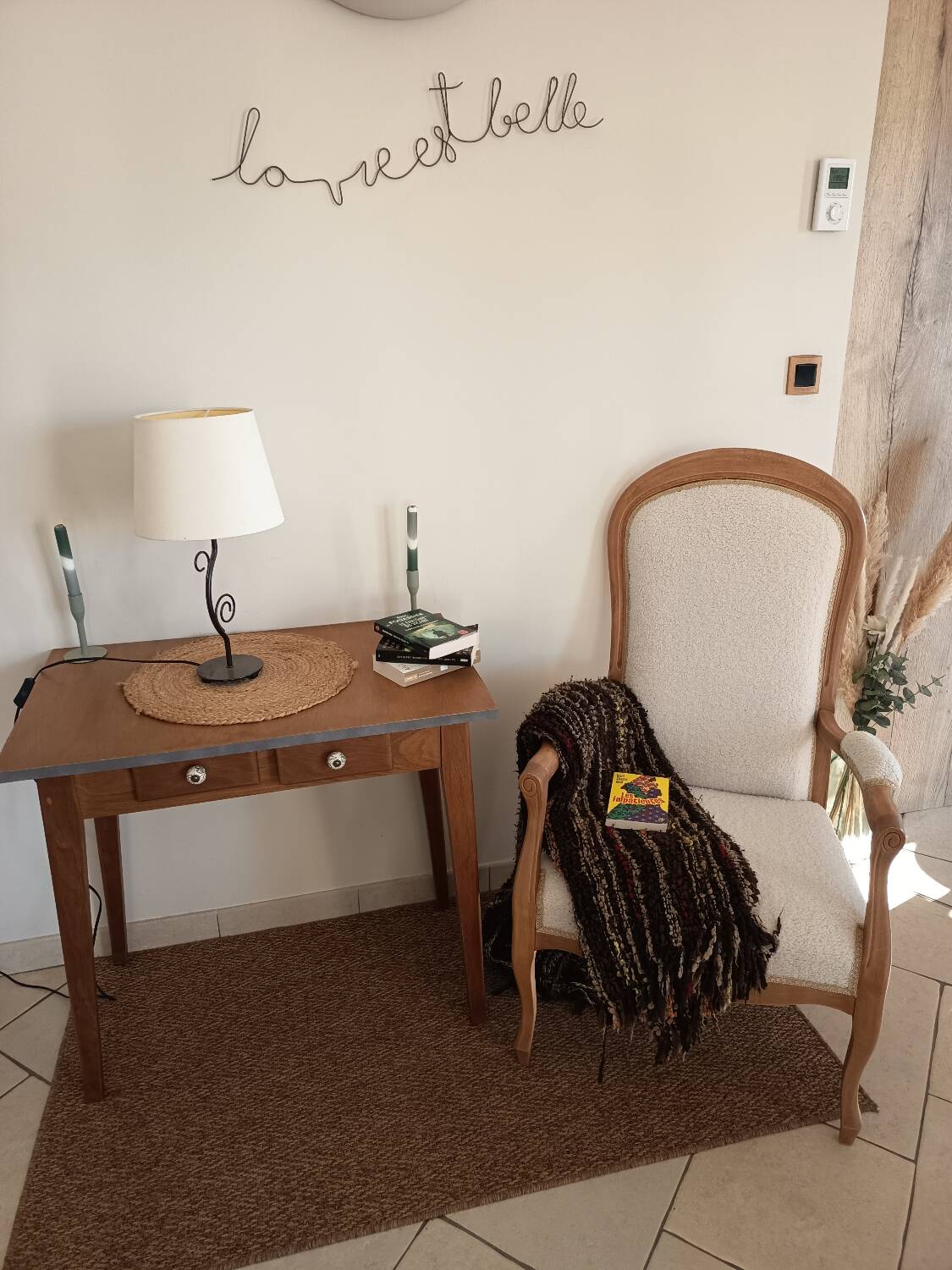 Renovated Voltaire armchair with boucle fabric.