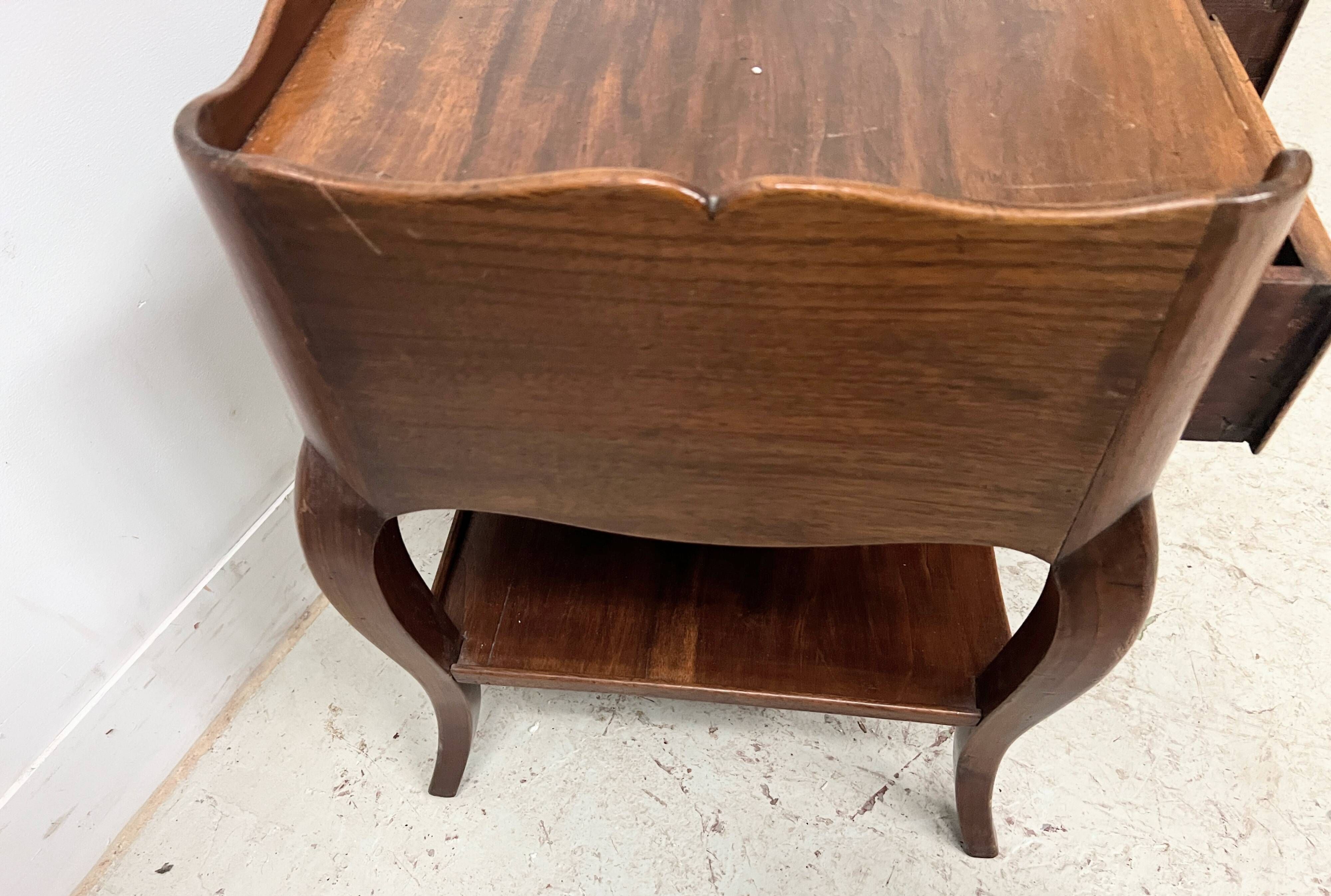 Louis XV style bedside table in solid walnut, 20th century.