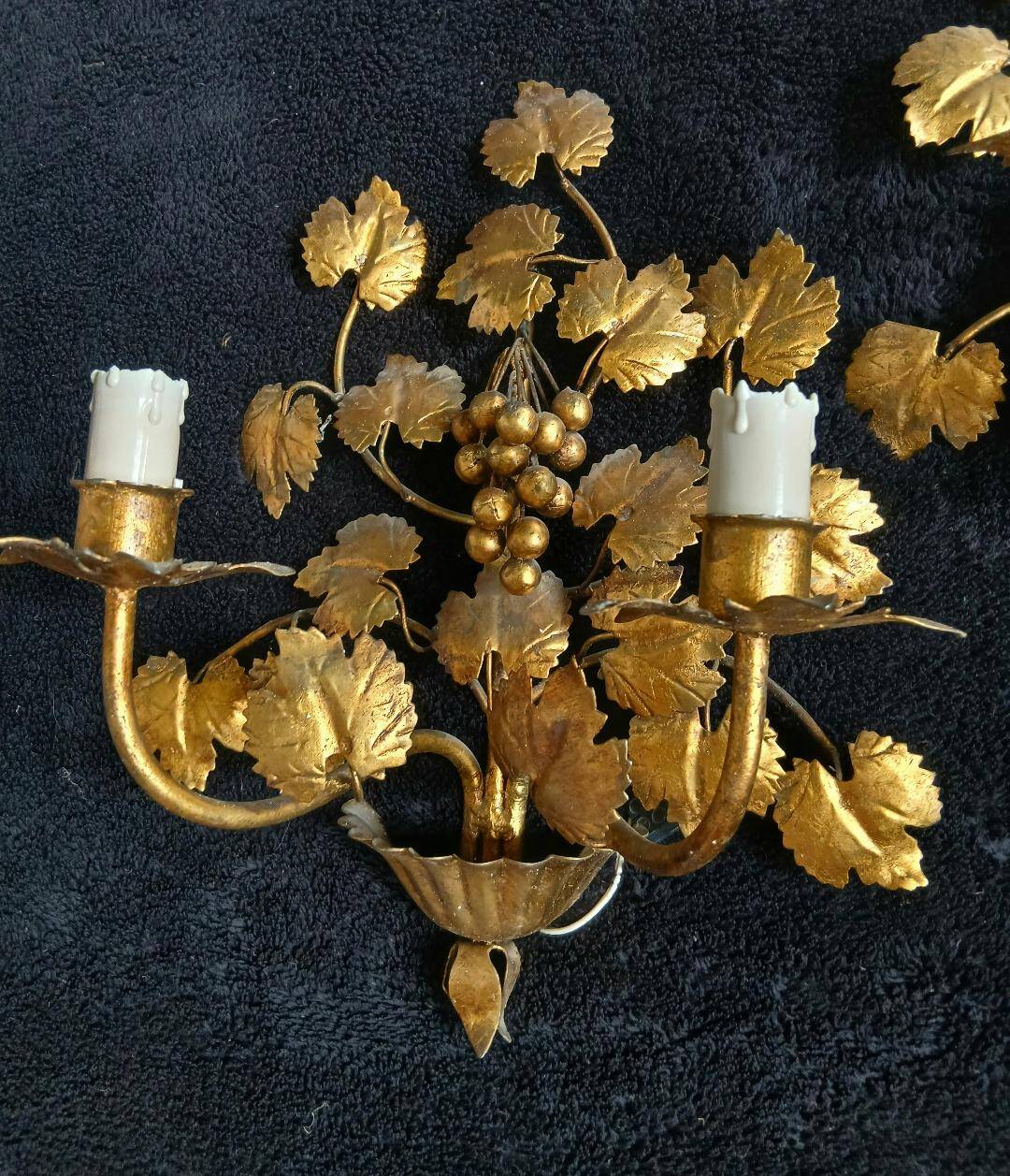 Stunning vintage wall lights in gilded iron with vine and grape decor from Italy.