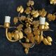 Stunning vintage wall lights in gilded iron with vine and grape decor from Italy.