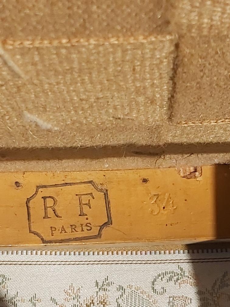 Pair of chairs with a golden lyre