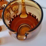 Carafe and its amber/gold glasses from the 70s