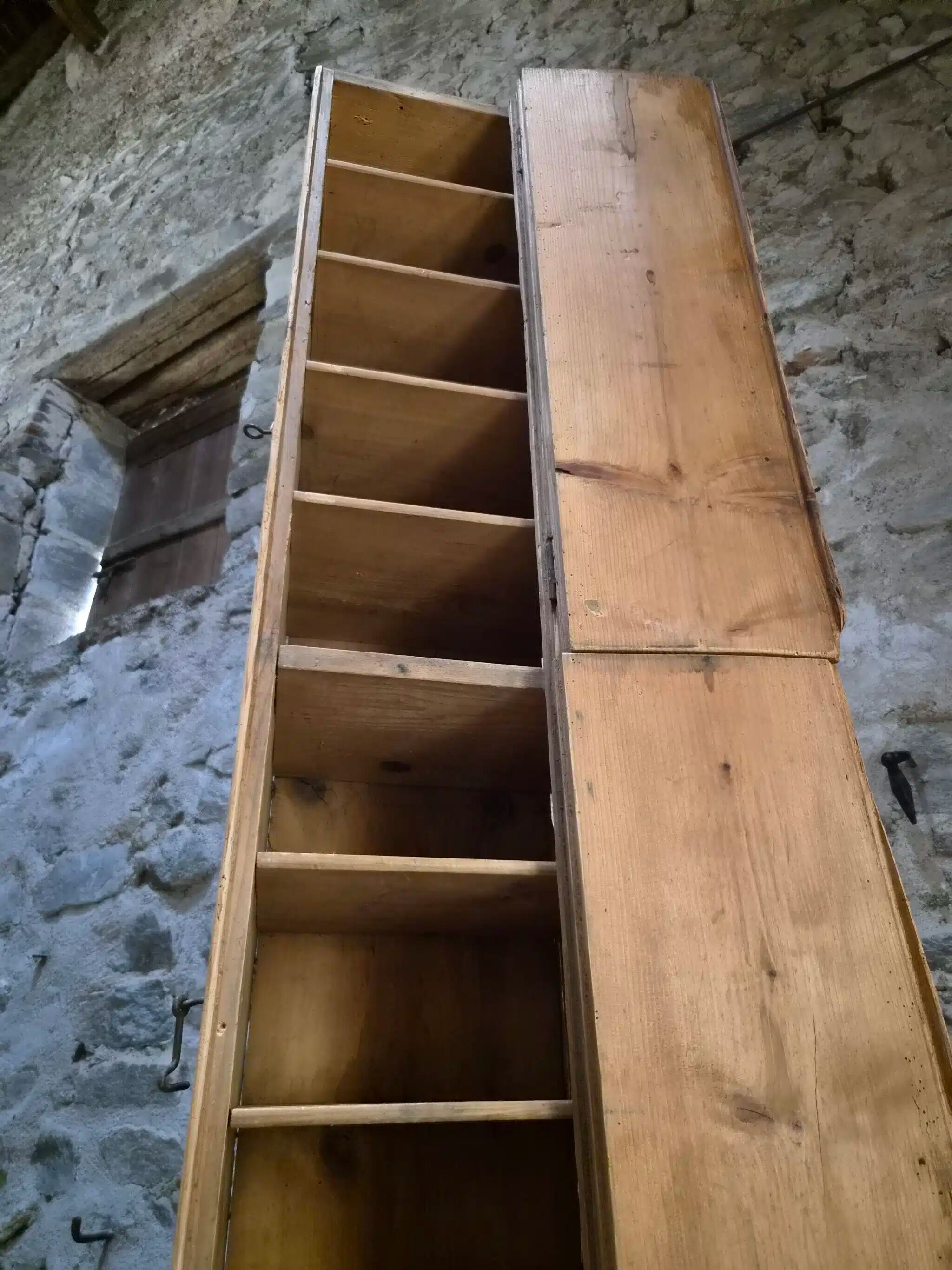 Antique French workshop cabinet in pine with compartments.