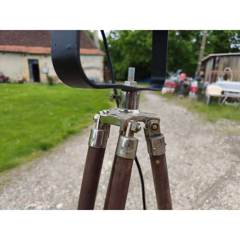 Spotlight on wooden and chrome tripod.