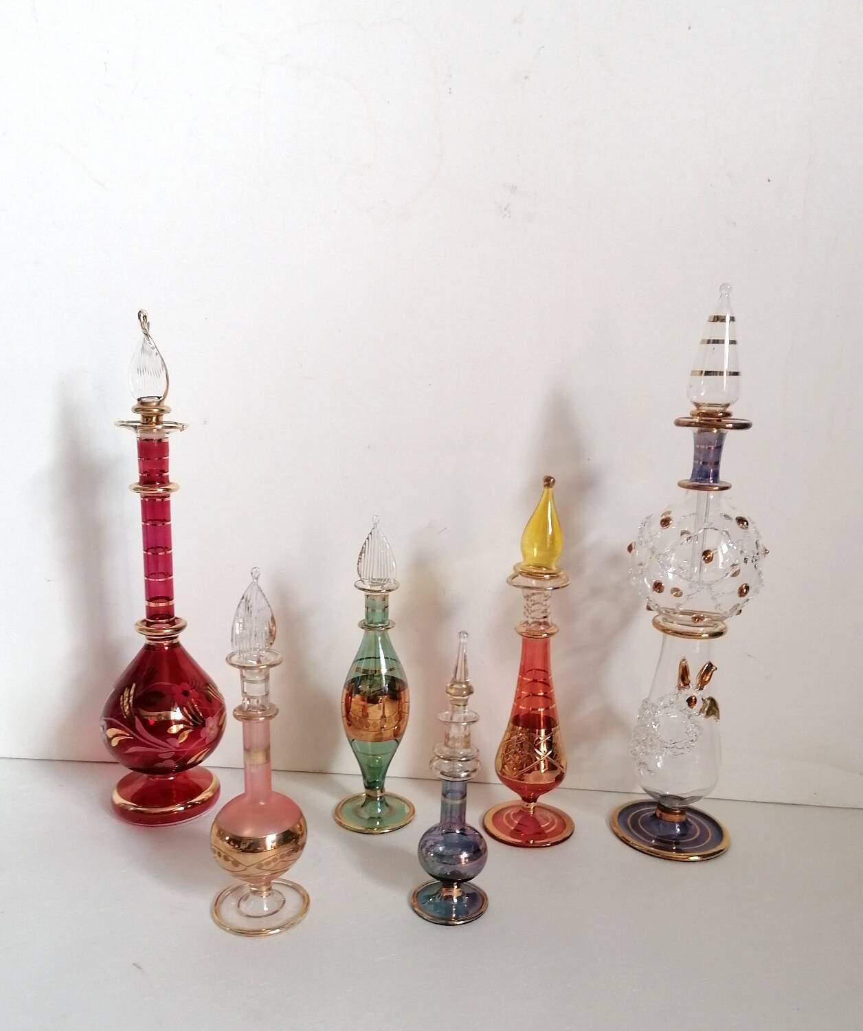 6 Egyptian gold and mouth-blown perfume bottles