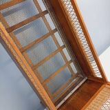 Vintage oak and rattan baby cot from the 1960s.