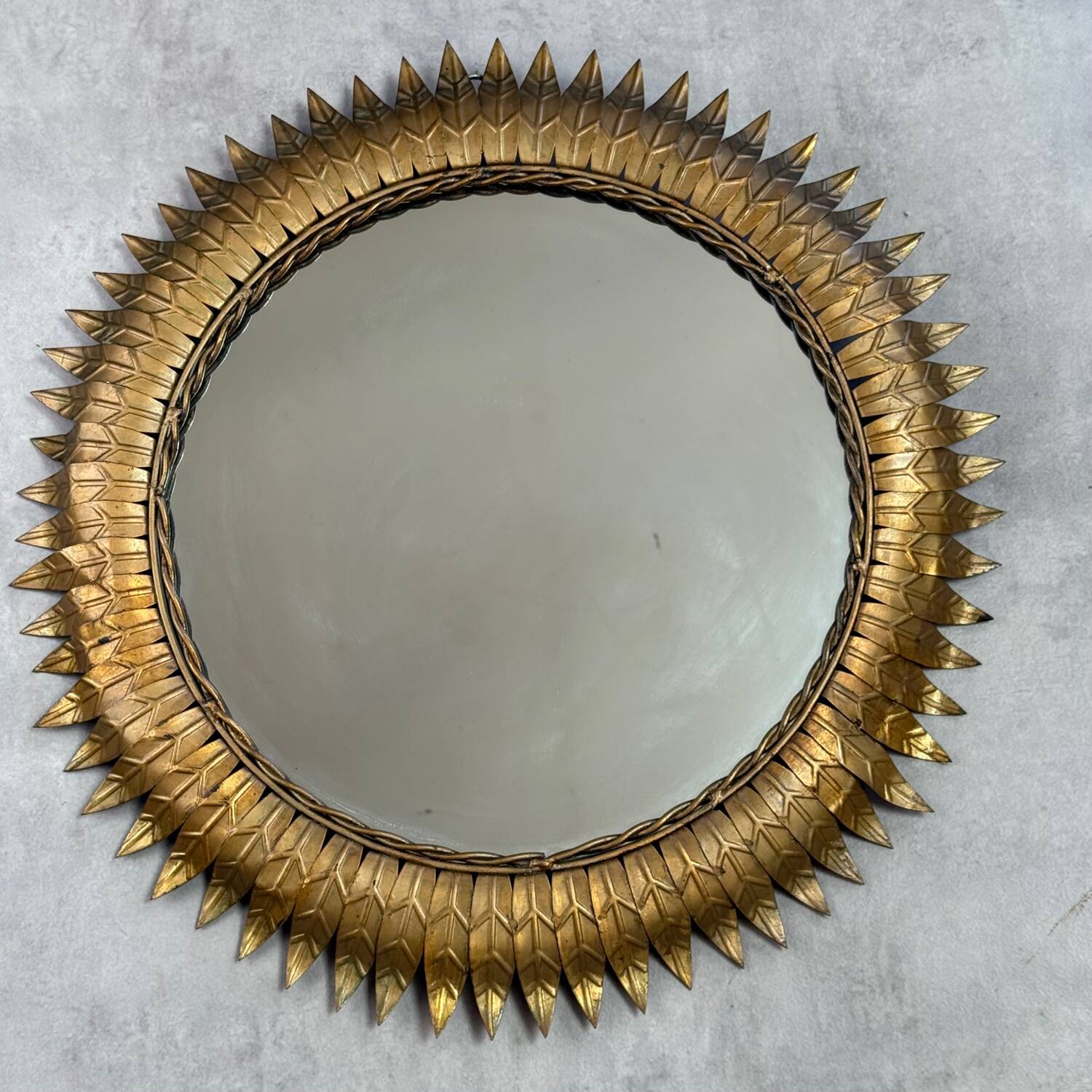 Round sun mirror in wrought iron from the 1950s Italy.