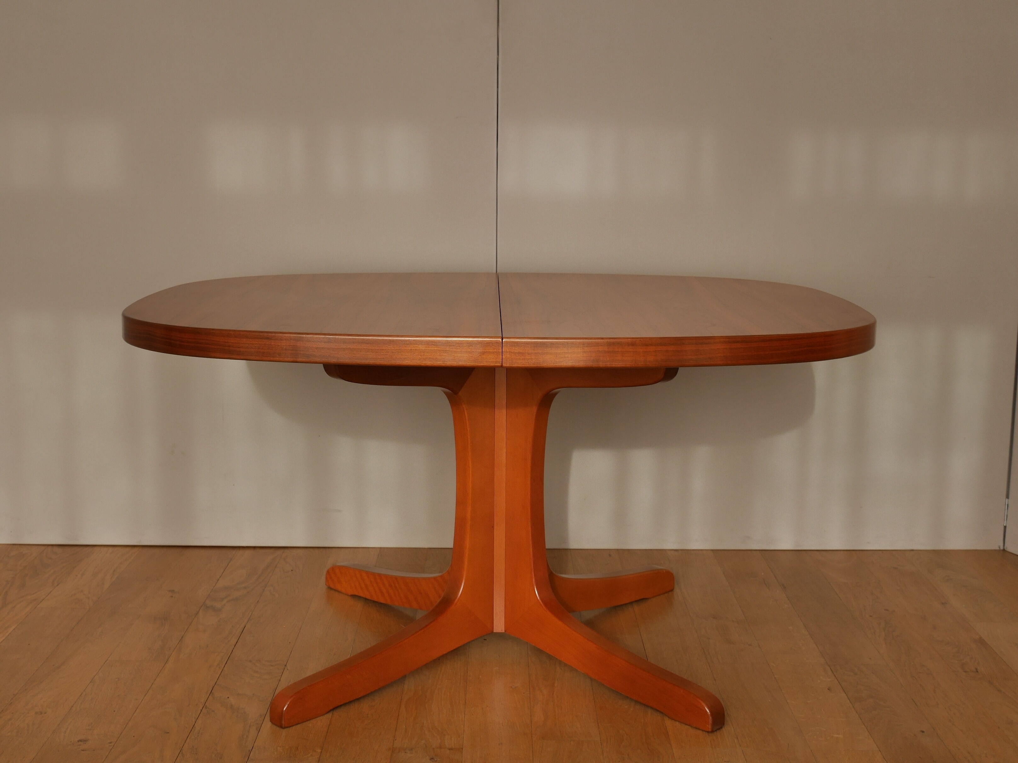 Oval walnut table with extension cords