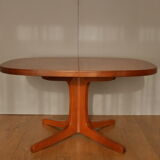 Oval walnut table with extension cords