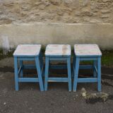Three blue wooden stools