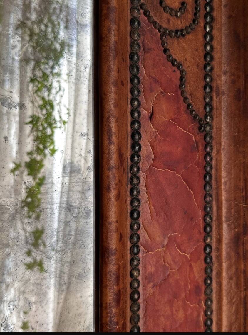 Antique mirror designed by "Pierre Lottier". Leather and nails. France 1