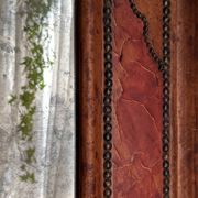 Antique mirror designed by "Pierre Lottier". Leather and nails. France 1