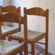 4 solid pine chairs, straw seats, shaped backrest.