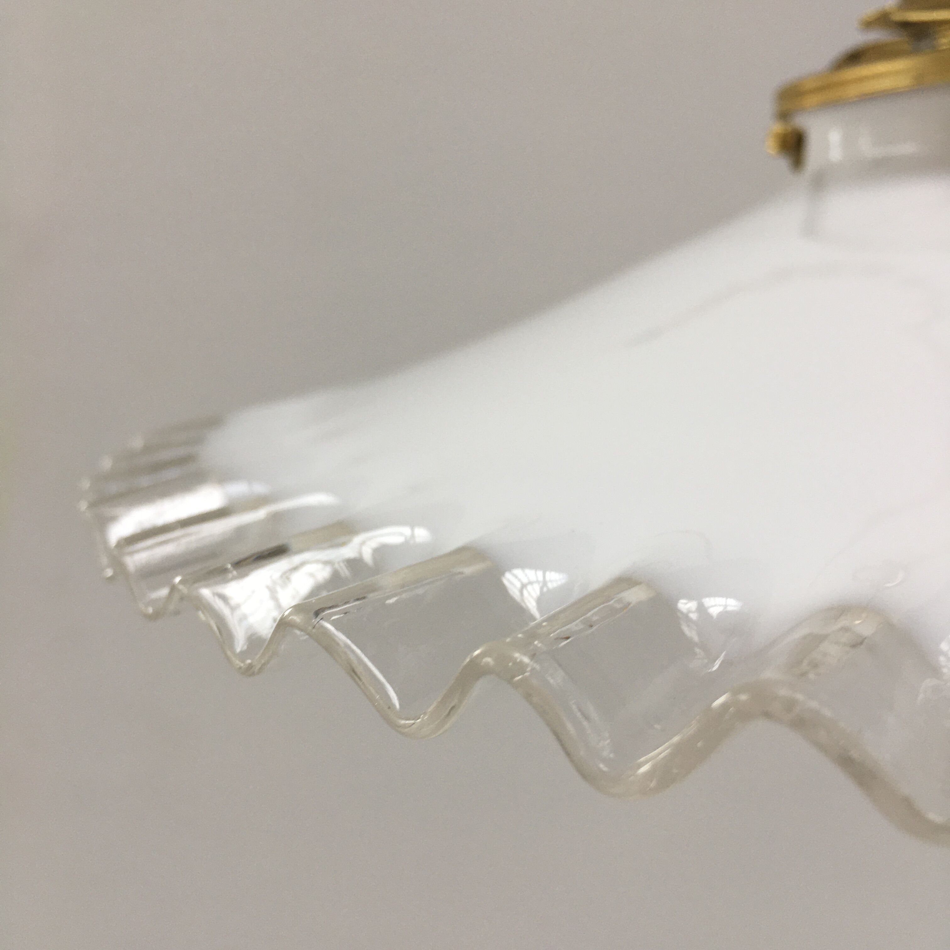 Pair of white opaline suspensions with serrated edges
