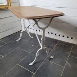 Bistro table with cast iron base and oak top
