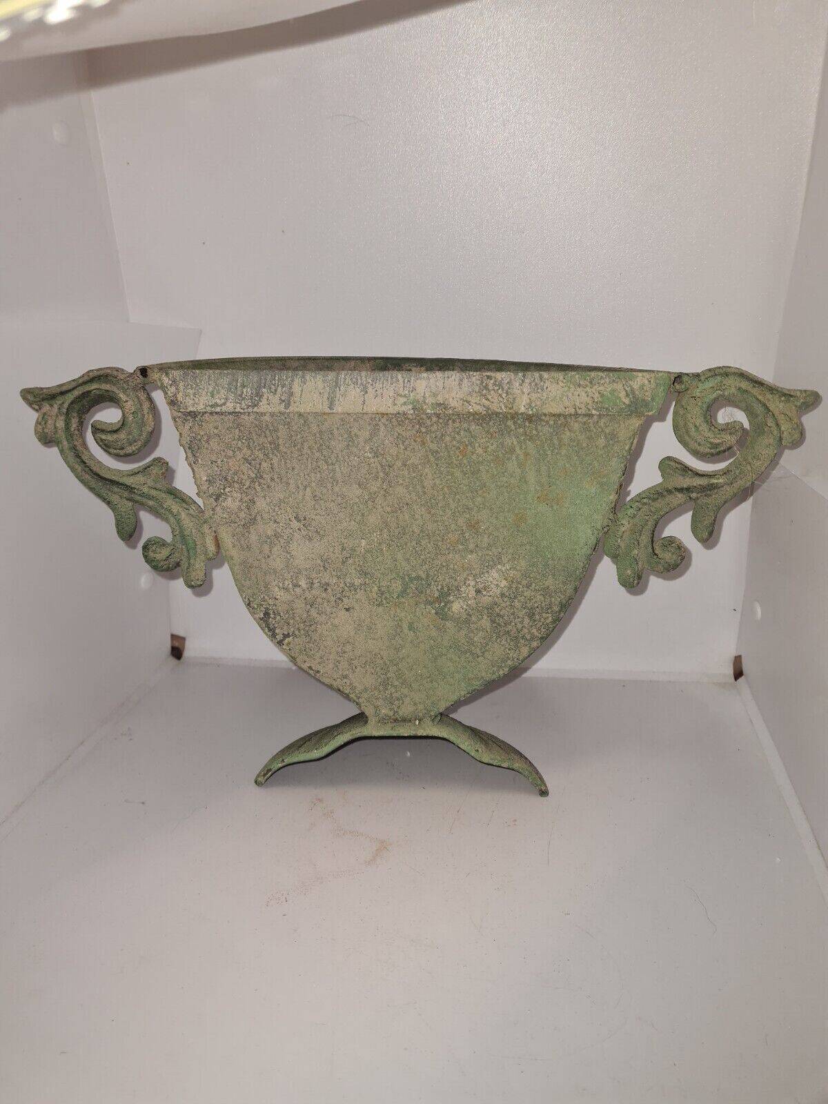 Medici wall vase in patinated iron